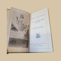 Libro 'Aliento de Piedad' con ilustración de la Última Cena, edición antigua ideal para decoración religiosa y coleccionistas de devocionarios.