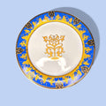 Sopera de porcelana decorada azul y oro con plato a juego