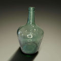 Damajuana antigua de cristal verde decorativa