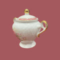 Azucarero TLimognes de porcelana fina con detalles únicos, asas doradas y flores pintadas a mano, ideal para decoración elegante en el hogar.