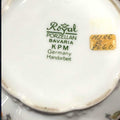 Sello inferior de la cajita de tocador Royal Porzellan Bavaria KPM única, porcelana artesanal alemana con inscripción 'Handarbeit'.