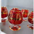 Copas de cristal Murano rojo con detalles dorados pintados a mano. Perfectas para una mesa sofisticada y con un toque de lujo artesanal.