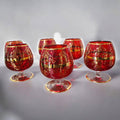 Set de copas de cristal Murano rojo con detalles dorados pintados. Ideal para quienes buscan cristalería exclusiva y refinada para su hogar.