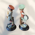 Lado lateral de figuras musicales italianas Armani, niños con tambor y saxofón, piezas decorativas de resina estilo Capodimonte.