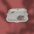 Pareja de bandejitas de porcelana con decoración floral romántica.