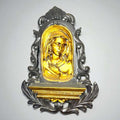 Detalle del rostro de la Dolorosa en madera dorada.