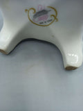 Base del jarrón de porcelana marca Sando con sello 'Made in Spain', ideal para decoración elegante en el hogar.