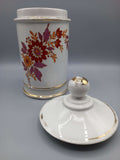 Tarro-Albarelo de Farmacia Antiguo en Porcelana con Decoración Floral en tonos rojos y dorados, ideal para decoración vintage en el hogar.