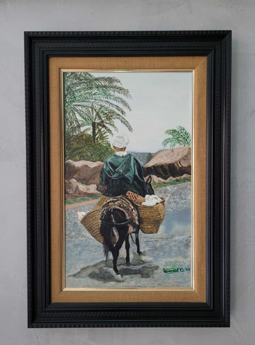 Este óleo, pintado por Luangel 93, muestra un paisaje con un árabe sobre un mulo cargado de alforjas, capturando la esencia y la historia de la escena. 