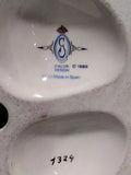 Sello Galos Design 1986 en la base de figura de porcelana Carlos, hecho a mano en España, autenticidad garantizada para coleccionistas.