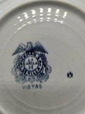 Sello en la base de un plato hondo de porcelana La Cartuja, modelo vistas, siglo XIX, con logotipo Pickman S.A. de Sevilla en negro.