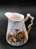 Jarra de leche de porcelana francesa Limoges con diseño de castillo y árboles, parte del Juego de Café Tú y Yo de 1915-1934, estilo clásico europeo.